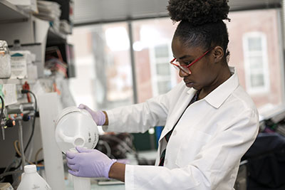 Student pouring a reagent